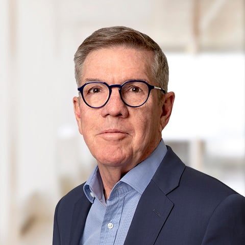 Pat Lawton professional headshot with patterned background.